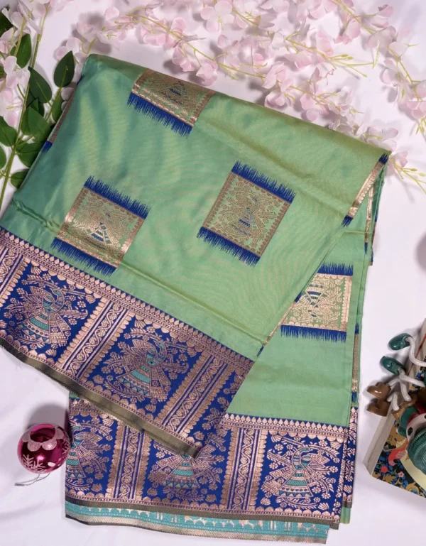 mint green baluchori silk saree with royal blue dancing motif border